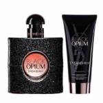 Un flacon de parfum Black Opium d'Yves Saint Laurent avec un fini noir pailleté et un tube assorti de fluide hydratant scintillant, tous deux étiquetés avec les logos Black Opium et YSL. Dakar