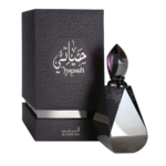 Un flacon de parfum élégant et facetté avec un bouchon pointu se trouve à côté d'une élégante boîte sombre ornée d'une écriture arabe et de "Al Haramain Hayati Eau de Parfum pour femme 12ml" en lettres argentées. Dakar