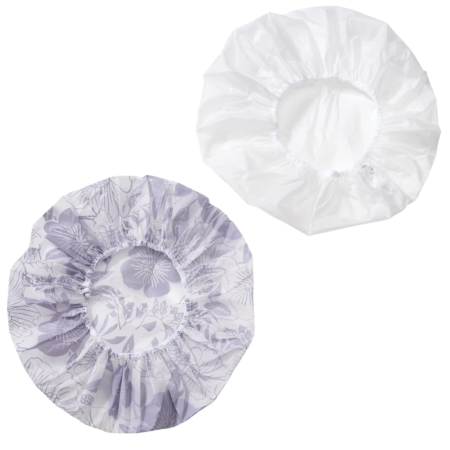 Deux bonnets de douche Ebelin Bonnet de Douche 1 pièce sont présentés à plat sur fond blanc : l'un est blanc uni, l'autre est blanc avec un motif floral gris clair. Les deux sont dotés de bords élastiques. Dakar