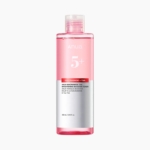 Une bouteille rose claire étiquetée "Anua 5+ Niacinamide + TXA Brightening Booster Toner", contenant 250 ml (8.45 fl. oz) de produit de soin de la peau, est représentée sur un fond blanc. Dakar