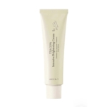 Un tube beige clair d'Axis Y Crème Éclaircissante TXA 2,5 % pour Teint Irrégulier 50 ml se tient debout avec un texte noir et un bouchon à vis blanc, conçu pour le soin de la peau. Dakar