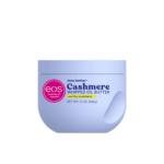 Un contenant violet clair d'eos Cashmere Whipped Oil Butter, étiqueté "Shea Better" et "vanilla cashmere", avec un logo rose d'eos et un texte indiquant un format de 10 oz (283g). Dakar