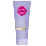 Le tube lavande de 207 ml d'EOS Beurre à Raser Parfum Cachemire comporte un logo rose, un texte blanc et or, et prétend "protéger, nourrir et prévenir les irritations". Beurre de rasage étiqueté "shea better" skin. Dakar
