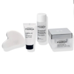 Quatre produits de soin de la peau, dont une pierre de gua sha blanche, un tube étiqueté "FILORGA Sleep & Lift", un flacon étiqueté "FILORGA Micellar Solution" et un pot carré étiqueté "FILORGA Time-Filler 5XP", sont disposés sur un fond blanc. Dakar