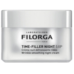 Un pot argenté de Filorga Time-Filler Night 5XP Wrinkle Smoothing Night Cream, avec un texte noir et gris décrivant le produit en anglais et en français sur la face avant. Dakar