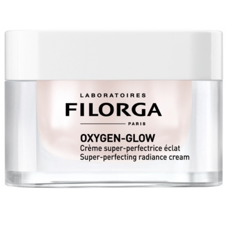 Un pot transparent de Filorga Crème Super Perfectrice Éclat et Anti Age Oxygen Glow 50 ml avec un couvercle blanc et une étiquette en texte noir en français et en anglais. Dakar