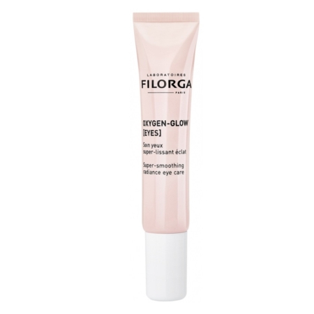 Un tube rose étiqueté "Filorga Oxygen-Glow [Eyes] Super-smoothing radiance eye care" avec un bouchon blanc, debout sur un fond blanc. Dakar