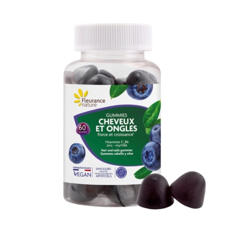 Un flacon de Fleurance Nature Complément Alimentaire Force + Croissance Cheveux et Ongles 60 gummies, aromatisé à la myrtille et étiqueté en français, est représenté avec deux gummies en forme de cœur. L'étiquette met en évidence les vitamines et les minéraux. Dakar