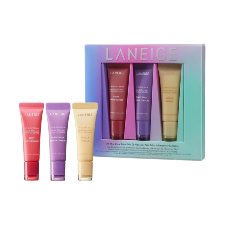 Quatre tubes de baume à lèvres LANEIGE en rose, rouge, violet et jaune, présentés dans une boîte pastel dégradée portant l'inscription "LANEIGE". La boîte présente trois des baumes dans des fenêtres découpées. Dakar