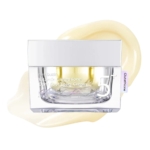 Un pot de 5+ Vitamin Glutathione Dark Spot Laser Cream est représenté avec un couvercle blanc et une base transparente, sur fond de tache jaune crème. Le mot "Glutathione" apparaît sur une petite étiquette latérale. Dakar