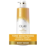 Olay Gel Douche Nettoyant et Éclaircissant à la Vitamin C 530ml présente une pompe blanche et des accents dorés, avec "Tone Brightening" mis en évidence sur l'étiquette dorée. Contient du sérum de vitamine C et du complexe de vitamine B3. Dakar