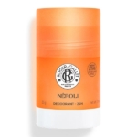 Bâton cylindrique orange du déodorant Roger & Gallet Néroli, avec un logo noir et blanc et des détails sur le produit en texte noir sur le devant. Dakar