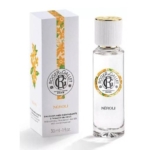 Un flacon en verre transparent du parfum Roger & Gallet Néroli se trouve à côté de sa boîte blanche, décorée de fleurs orange. Le flacon et la boîte affichent tous deux le logo de la marque et les détails du produit en noir et en orange. Dakar