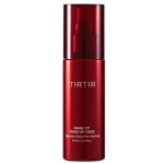 Un flacon rouge de Tirtir Mask Fit Fixateur de Maquillage Waterproof et Anti Transpiration 80 ml avec un bouchon transparent et un texte blanc se tient debout sur un fond blanc. Dakar