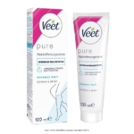Un tube et une boîte de crème dépilatoire Veet Pure pour peau sensible, 100 ml, avec des accents bleus et roses, et une simple illustration de jambes sur l'emballage. Dakar