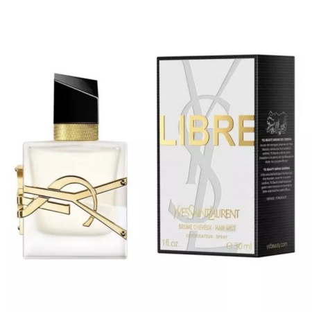 Un flacon de brume capillaire Yves Saint Laurent Libre avec un bouchon noir et or est posé à côté de son coffret noir et or assorti, tous deux arborant le logo YSL en bonne place. Dakar