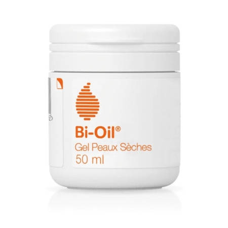 Un pot blanc de 50 ml de Bi-Oil Gel pour peau sèche, avec un logo en forme de goutte d'eau orange et un texte en français et en anglais sur l'étiquette frontale. Dakar