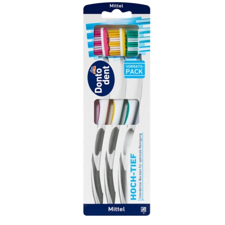 Trois brosses à dents Dontodent dans un emballage en plastique, chacune avec des poils et des manches de couleur différente - rose, jaune et vert. Le texte de l'emballage est principalement en allemand et porte la mention "Mittel", qui indique des poils moyens. Dakar