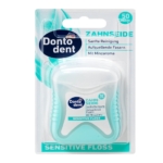 Un paquet de fil dentaire Dontodent Sensitive Floss avec 50 mètres de fil dentaire aromatisé à la menthe dans un contenant blanc et sarcelle, présenté dans un emballage transparent avec un texte en allemand et des détails sur le produit. Dakar