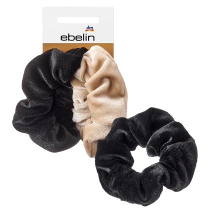 Deux chouchous en velours, l'un noir et l'autre beige, avec une étiquette de la marque ebelin en arrière-plan. Les chouchous semblent doux et sont présentés sur un fond blanc. Dakar