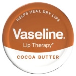 Une boîte ronde de Vaseline Lip Therapy au beurre de cacao, avec une étiquette orange et blanche indiquant "Helps Heal Dry Lips" (aide à soigner les lèvres sèches) et "Cocoa Butter" (beurre de cacao). Dakar