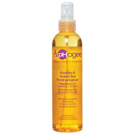 Un flacon pulvérisateur transparent d'ApHogee Keratin & Green Tea Restructurizer avec une étiquette orange et un embout de pompe, avec des détails sur le produit en anglais, espagnol et français. Dakar