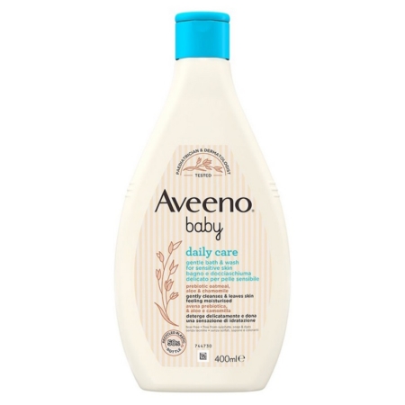 Un flacon blanc d'Aveeno Baby Bain et Douche Gel Délicat Peau Sensible Bébé 400 ml, avec un bouchon bleu et une étiquette beige avec des motifs végétaux marron doux. Les détails du produit apparaissent en anglais et en italien. Dakar