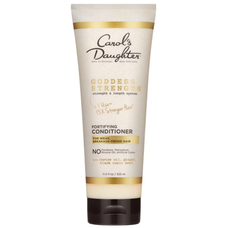 Tube d'après-shampoing fortifiant Goddess Strength de Carol's Daughter pour les cheveux fragiles et sujets aux cassures, avec un design beige et or aux accents noirs et une liste d'ingrédients clés, dont de l'huile de ricin et des graines de nigelle. Dakar