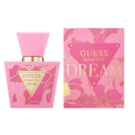 Un flacon rose du parfum GUESS Seductive Dream est présenté à côté de sa boîte florale rose et or assortie. Les deux présentent un lettrage et des accents de design audacieux en or. Le flacon est doté d'un large bouchon et d'une étiquette triangulaire. Dakar
