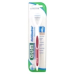 Un gratte-langue GUM Halicontrol emballé avec une poignée blanche et rose, présenté dans un étui en plastique et en carton avec des accents bleus et verts et le nom de la marque SUNSTAR en haut. Dakar