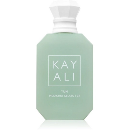 Un flacon de parfum octogonal vert clair étiqueté "KAYALI YUM PISTACHIO GELATO | 33" avec un bouchon géométrique blanc, sur un fond blanc uni. Dakar