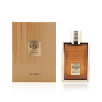 Le flacon de 100 ml de l'Eau de Parfum Mixte Khadlaj Karus Amber Gold se trouve à côté de son coffret texturé or et marron avec des lignes verticales et une étiquette centrée, soulignant l'élégance de la présentation du parfum. Dakar