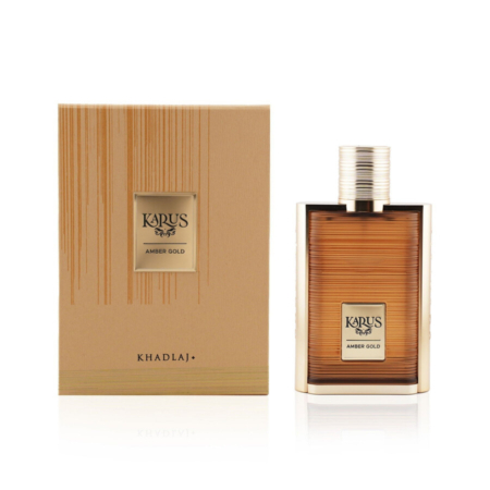 Le flacon de 100 ml de l'Eau de Parfum Mixte Khadlaj Karus Amber Gold se trouve à côté de son coffret texturé or et marron avec des lignes verticales et une étiquette centrée, soulignant l'élégance de la présentation du parfum. Dakar