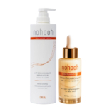 Deux produits de soins de la peau de Nohooh Monaco : un grand flacon pompe étiqueté "Lotion Réparatrice Blanchissante" (500ml) et un plus petit flacon compte-gouttes étiqueté "Sérum éclaircissant anti-taches pour le visage et le cou" (50ml). Dakar