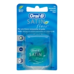 Un paquet de fil dentaire Oral-B Satin Floss dans un contenant bleu, présenté dans un emballage bleu et vert avec des informations sur le produit en plusieurs langues et le logo Oral-B bien en évidence. Dakar