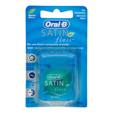 Un paquet de fil dentaire Oral-B Satin Floss dans un contenant bleu, présenté dans un emballage bleu et vert avec des informations sur le produit en plusieurs langues et le logo Oral-B bien en évidence. Dakar
