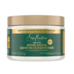 Un pot de 311 g de Shea Moisture Bond Repair Masque Réparateur et Hydratant avec une étiquette verte et dorée promouvant "84% moins de casse" et "l'infusion HydroPlex réparatrice" - de la ligne Shea Moisture Bond repair. Dakar