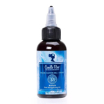 Un flacon de 59 ml de Camille Rose Black Castor Oil + Chebe Repair Pure Strengthening Oil avec une étiquette bleue et un bouchon applicateur pointu. Dakar