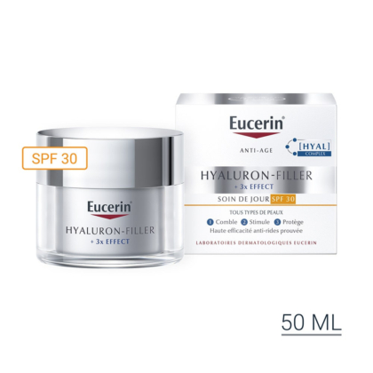 Un pot et une boîte de 50 ml de la crème de jour Eucerin Hyaluron-Filler 3x Effect avec SPF 30, étiquetée pour tous les types de peau. L'emballage est blanc avec des accents argentés et des reflets orange pour le SPF 30. Dakar