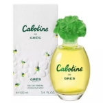 Un flacon de parfum Cabotine de Grès avec un bouchon floral vert est présenté devant sa boîte, qui est blanche avec des accents de fleurs vertes et jaunes. Le flacon contient 100 ml d'eau de parfum. Dakar