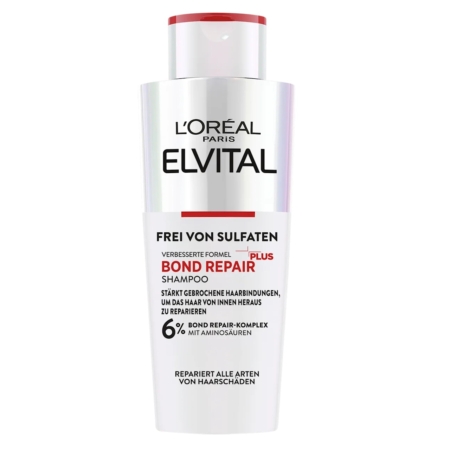 Un flacon blanc de L'Oréal Paris Elvital Bond Repair Shampoo avec une étiquette rouge et noire, comportant un texte en allemand soulignant qu'il est sans sulfate et qu'il contient un complexe réparateur de 6 % avec des acides aminés. Dakar