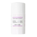 Un produit cylindrique blanc en forme de bâton, étiqueté comme un traitement clarifiant pour les aisselles, avec un texte en français et des accents violets clairs. Le produit prétend éclaircir et embellir les aisselles grâce à un traitement d'un mois. Dakar