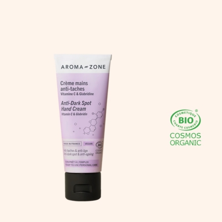 Aroma Zone Crème Mains Anti Taches Vitamine C et Glabridine 50 ml est représenté sur fond clair, avec le logo vert COSMOS ORGANIC certifié biologique visible. Dakar