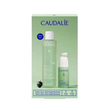 Un coffret vert de soins Caudalie comprenant Vinopure Purifying Toner (200ml) et Vinopure Serum (30ml) avec des textes en français et en anglais, et une illustration de raisin noir sur le devant. Dakar