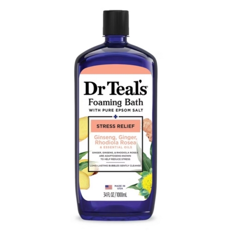 Bain Moussant aux Huiles Essentielles Anti Stress 964 ml, étiqueté "Soulagement du stress", mélange le sel d'Epsom avec des huiles de ginseng, de gingembre et de rhodiola. Le flacon présente des illustrations de gingembre et de feuilles vertes. Dakar
