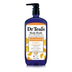 Une bouteille de Dr Teal's Body Wash with Pure Epsom Salt, étiquetée "Glow & Radiance" avec de la vitamine C et des huiles essentielles d'agrumes, 24 fl oz/710 mL. L'étiquette présente des tranches d'orange et les avantages du produit. Dakar