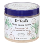 Un pot de Dr Teal's Shea Sugar Scrub à l'huile de coco, avec des images de noix de coco et de feuilles de palmier sur l'étiquette. Le pot indique qu'il contient du beurre de karité, de l'huile de coco et de l'huile d'avocat, et qu'il est sans parabène. Dakar