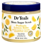 Un pot de 538 g de Dr Teal's Gommage au Sucre de Karité Prébiotique Mélisse, avec des images de tranches de citron sur l'étiquette et un couvercle bleu. Dakar