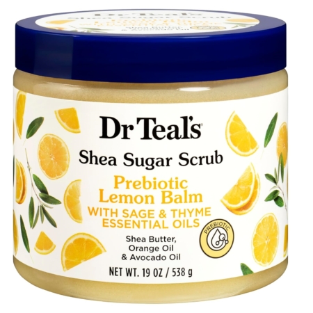 Un pot de 538 g de Dr Teal's Gommage au Sucre de Karité Prébiotique Mélisse, avec des images de tranches de citron sur l'étiquette et un couvercle bleu. Dakar