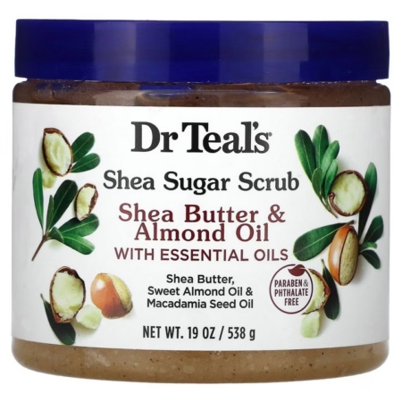 Teal's Gommage au Sucre et au Beurre de Karité Huile d'Amande Douce et d'Huiles Essentielles 538 g se présente dans un pot de 19 oz avec des noix et des feuilles de karité sur son étiquette, mettant en valeur les huiles essentielles et une formule sans parabène ni phtalate. Dakar
